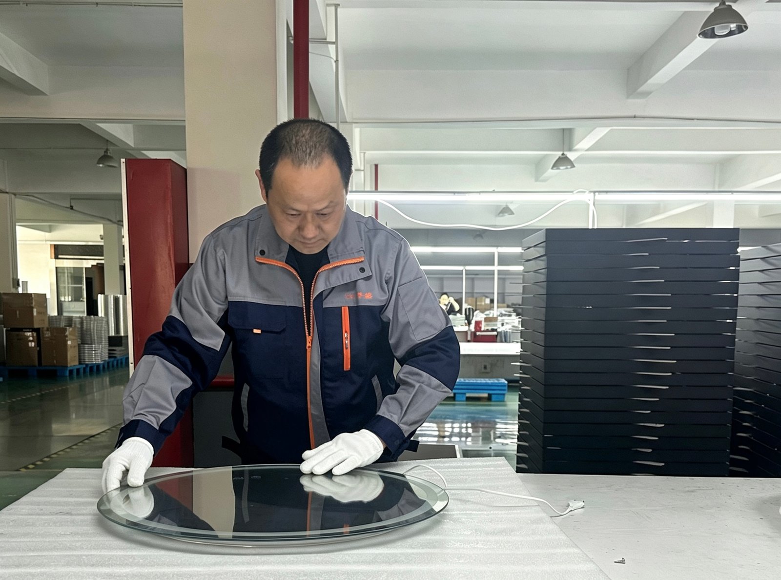 Worker checking round mirror sample